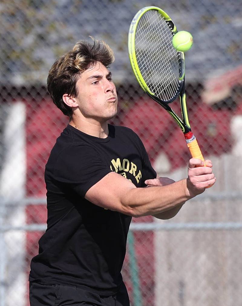 Sycamore number three doubles player Joe Culotta returns a serve Wednesday, April 26, 2023, during their match against DeKalb at Sycamore High School.