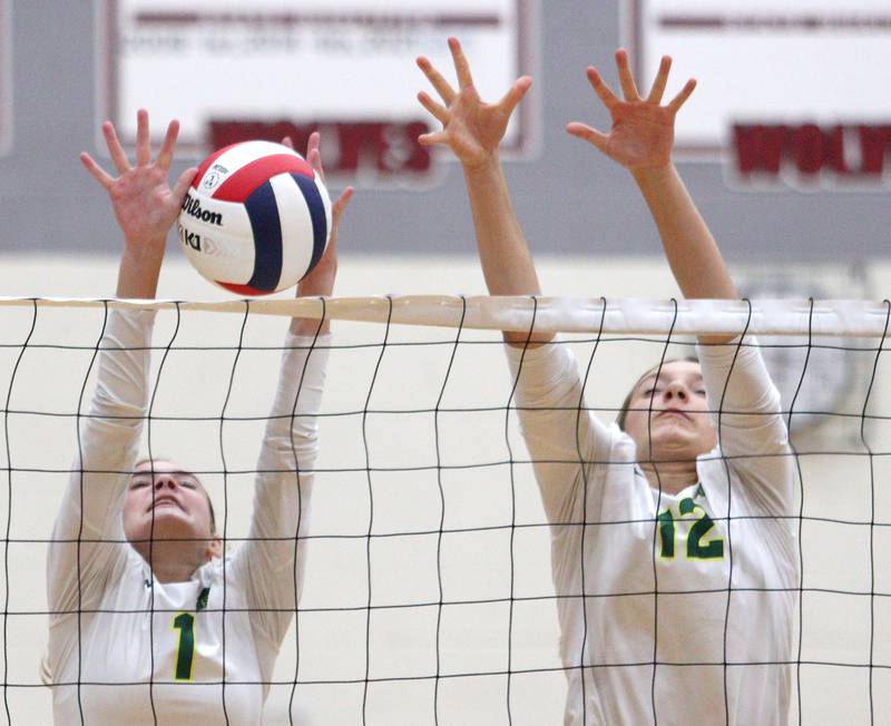 Crystal Lake South’s Olivia Apt, left, and Joanna Kruolek block in varsity girls volleyball on Thursday, Aug. 29, 2024, at Prairie Ridge High School in Crystal Lake.