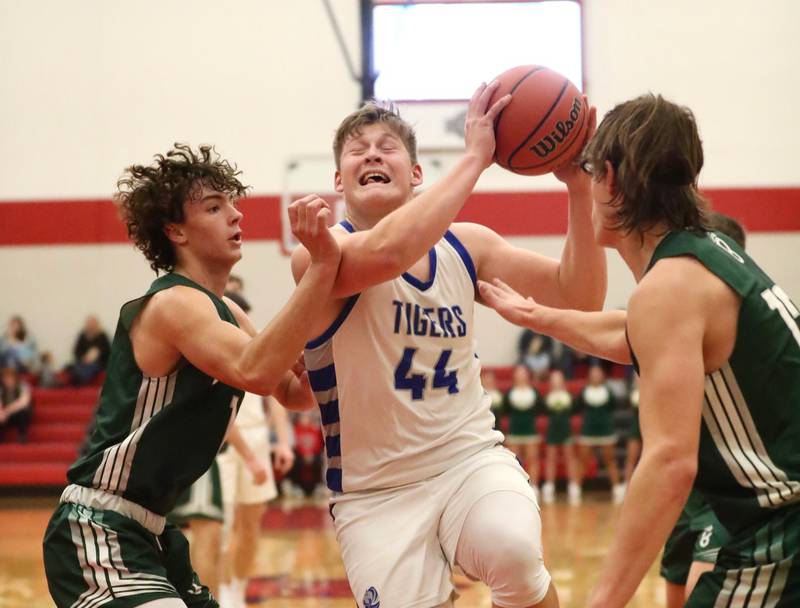 Princeton's Bennett Williams drives against St. Bede's Connor Brown and Landon Jackson Saturday night in the Colmone Classic.