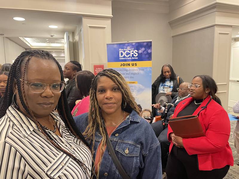 Tina Clayborne and Cyrenthia Threat stand in line to process their applications at the Illinois Department of Children and Family Services’ On-The-Spot Hiring event on Wednesday at the Fountains Conference Center in Fairview Heights. DCFS Officials said 303 people attended with 123 receiving conditional job offers.