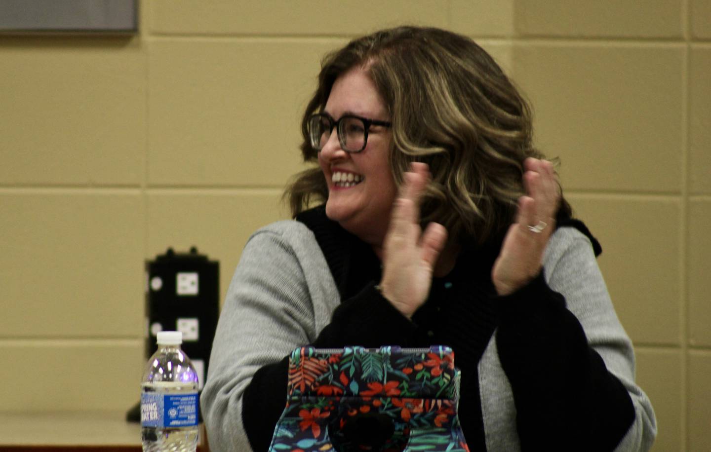 Sterling Public Schools board of education President Pam Capes applauds the efforts of building principals during a moment of recognition on Wednesday, oct. 26, 2022, at a regular meeting.