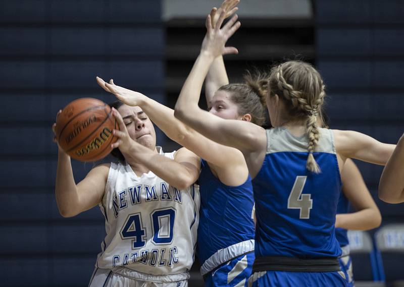 Newman’s Amiya Rodriguez works against defenders Thursday, Jan. 5, 2023 against Princeton.