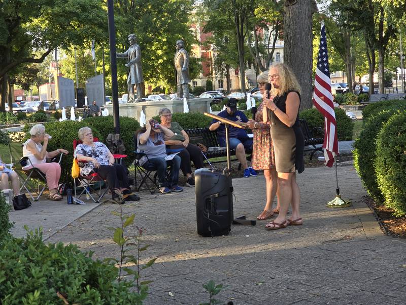 Teresa Schmidt (with microphone) and Crystal Loughran speak Thursday, Aug. 29, 2024, at an event at Washington Square in Ottawa.