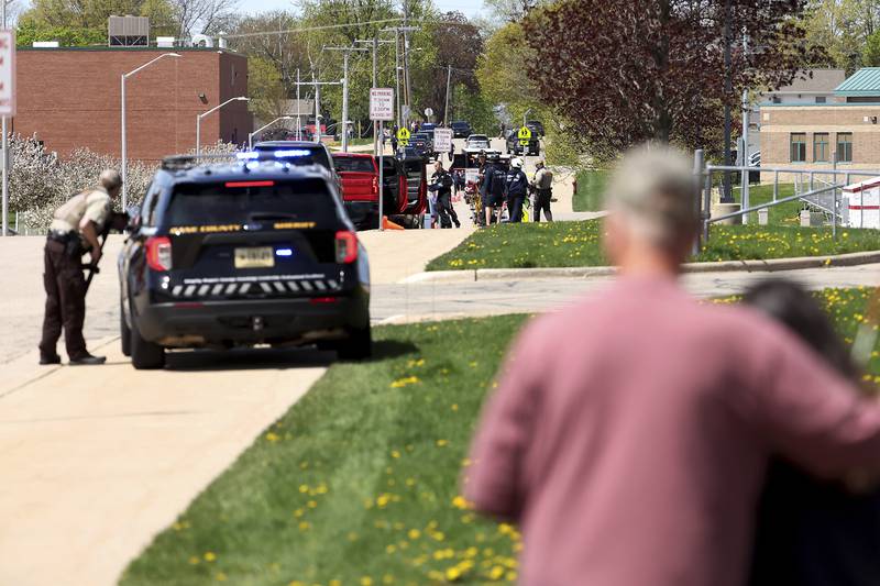 Law enforcement personnel respond to a report of a person armed with a rifle at Mount Horeb Middle School in Mount Horeb, Wis., Wednesday, May 1, 2024. The school district said a person it described as an active shooter was outside a middle school in Mount Horeb on Wednesday but the threat was “neutralized” and no one inside the building was injured.