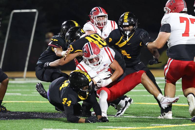 Joliet West’s defense brings down Yorkville’s Luke Zook for a loss on Friday, Sept. 13, 2024 in Joliet.