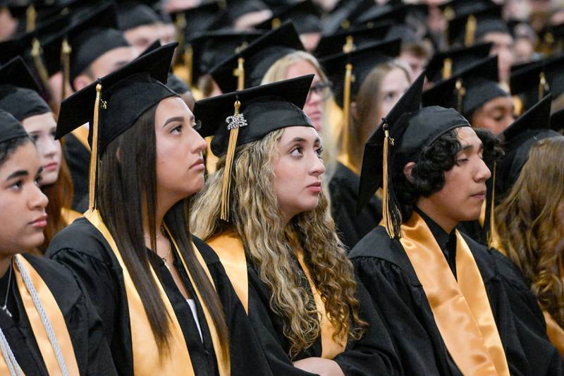 Graduates listen to the class speakers during the 2024 Sycamore High School commencement in Sycamore on Sunday, May 26, 2024.