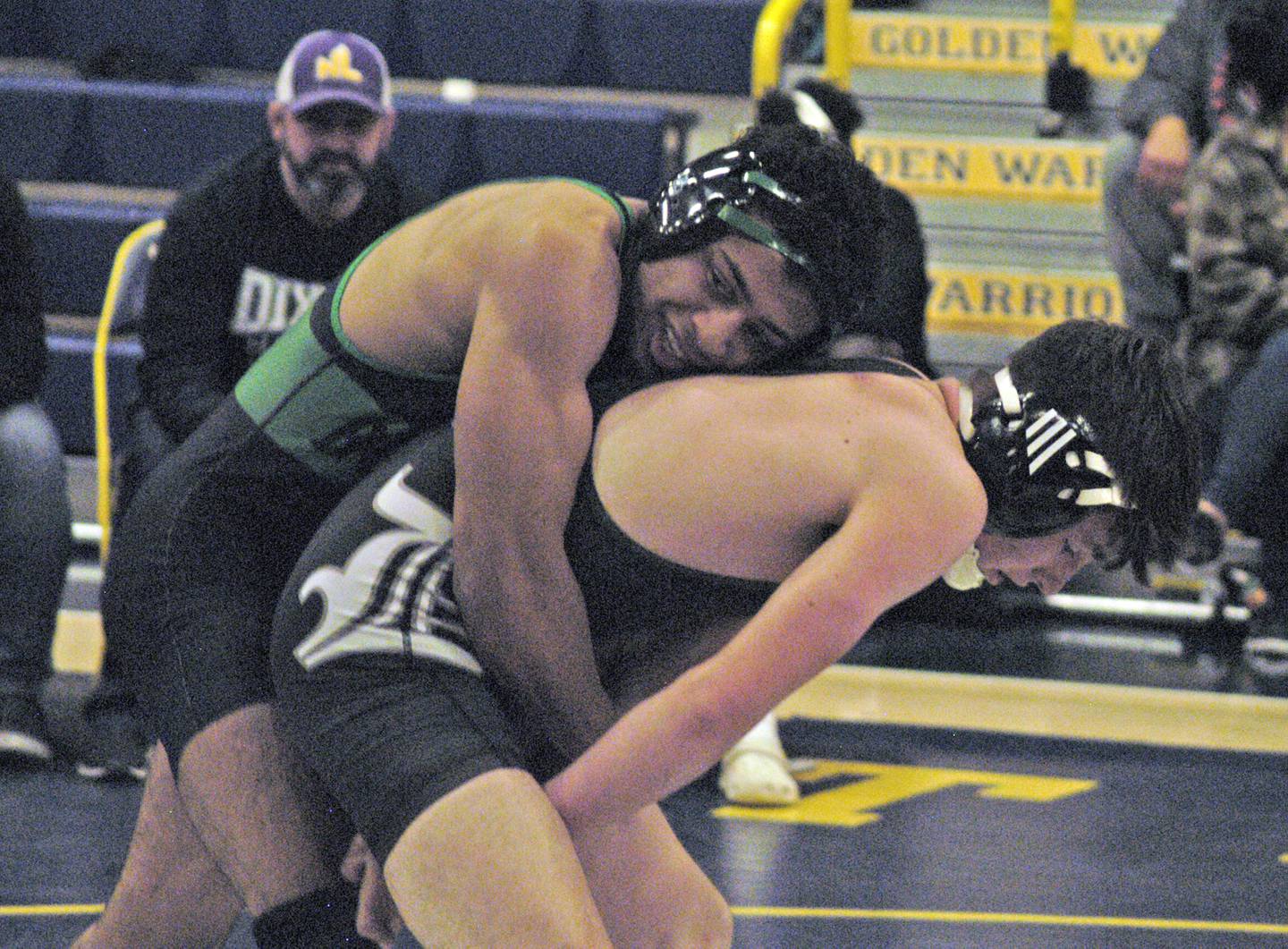 Rock Falls' Adan Oquendo (left) and Dixon's Gavin Kramer (right) battle in the 132-pound championship match. The action took place on Saturday, Dec. 2, 2023, at Sterling High School's 45th Annual Carson DeJarnatt Tournament.