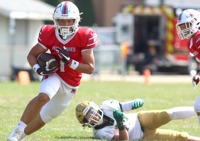 Marian Central’s Eddie Kowalczyk runs the ball against  Bishop McNamara in varsity football action on Saturday, Sept. 14, 2024, at George Harding Field on the campus of Marian Central High School in Woodstock.