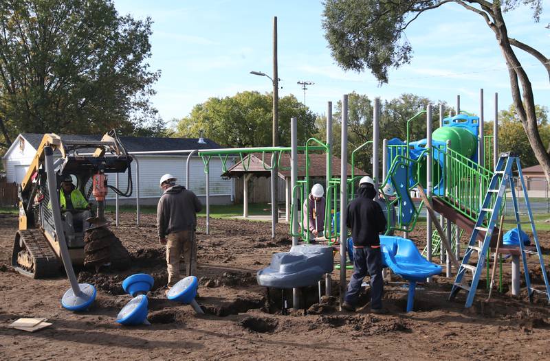 A crew from Custom Playgrounds in Rockford install new playground equipment at Sunset Park on Tuesday, Oct. 17, 2023 in Peru. Installation began this week on about $150,000 of upgraded playground equipment located on the south east part of Sunset Park near the intersection of 2nd and Henry Streets. The city received a grant of $43,000 for the new playground. Crews are hoping to have it completed by next week.