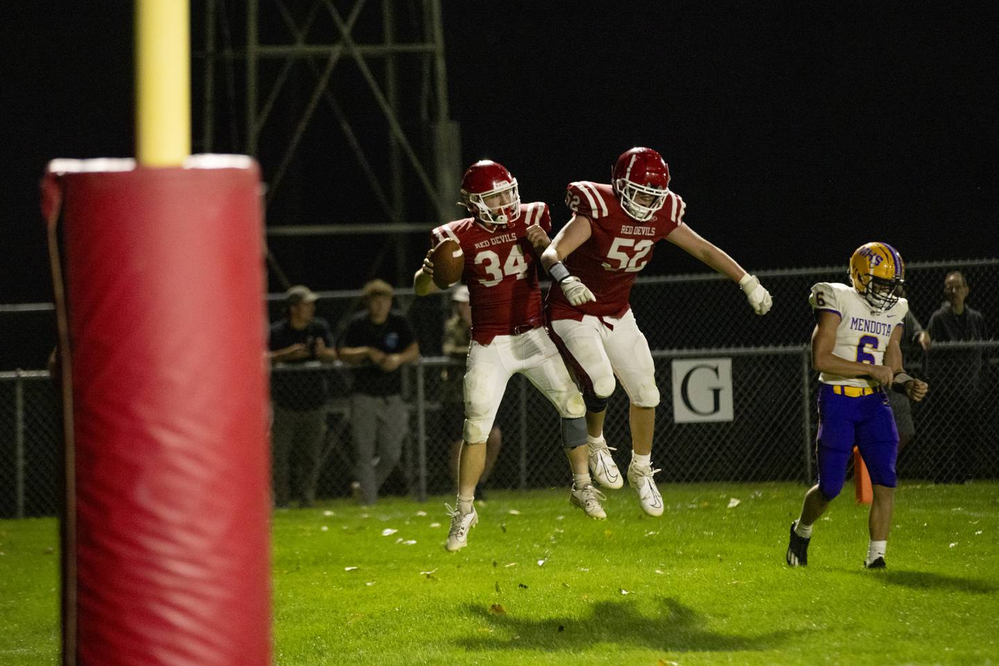 Hall High School players Aiden Redcliff (left) and Cameron Spradling (right) celebrate a touchdown against Mendota during the game at Richard Nesti Stadium on September 13, 2024.