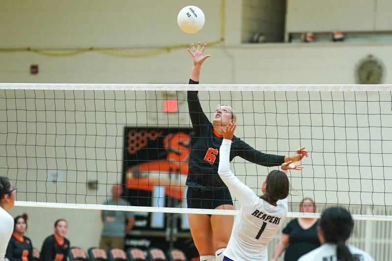 Sandwich's Londyn Scott (6) plays the ball at the net against Plano’s Hennessy Pena (1) during a volleyball match at Sandwich High School on Tuesday, Sep 10, 2024.