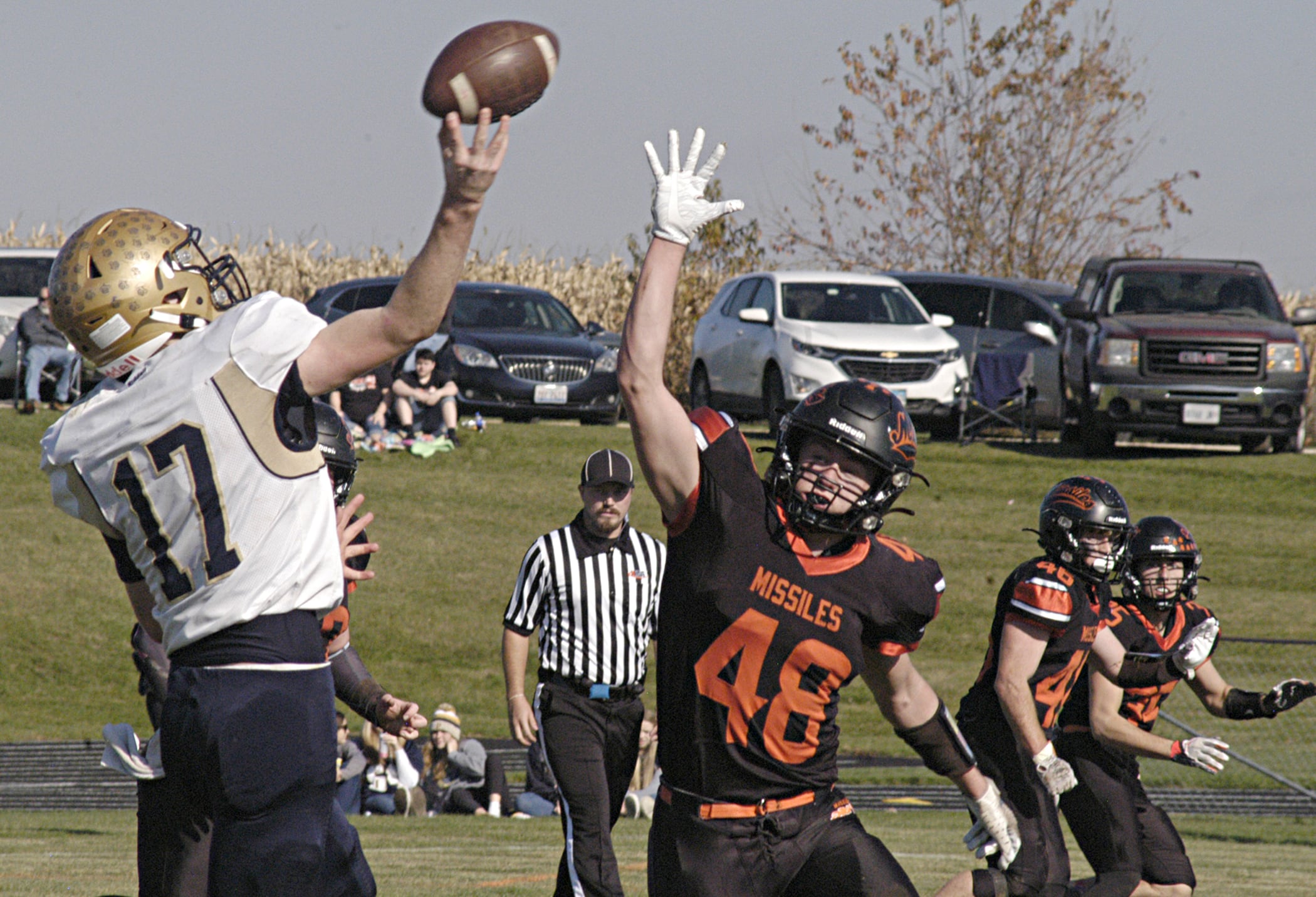 Polo's Brock Sollow  (17) throws a pass over Milledgeville defender Karter Livengood Saturday, Nov. 4th, 2023 in round 2 of  the 18FA  football bracket at Milledgeville.