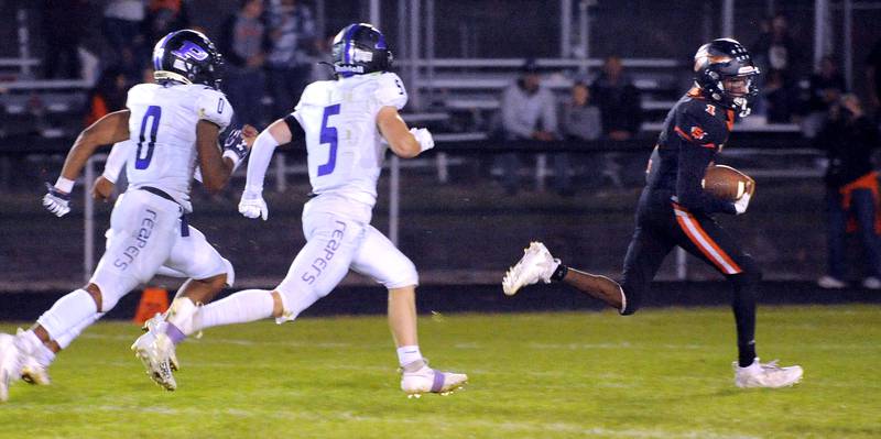 Sandwich running back Simeion Harris (1) gets past the Plano defense for a touchdown during a varsity football game at Sandwich High School on Friday, Sept. 8, 2023.