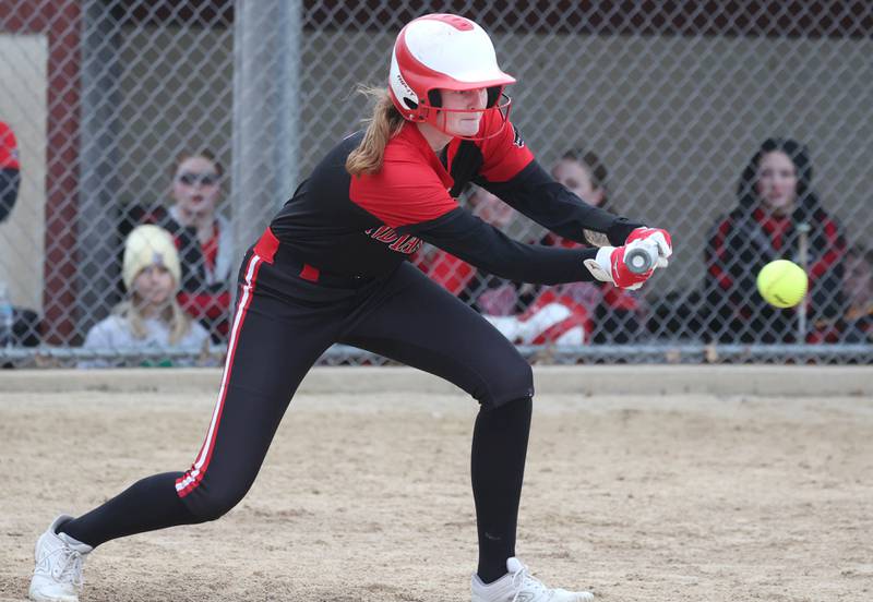 Indian Creek’s Allie Peterson lays down a bunt during their game against Mendota Thursday, March 14, 2024, at Indian Creek High School in Shabbona.