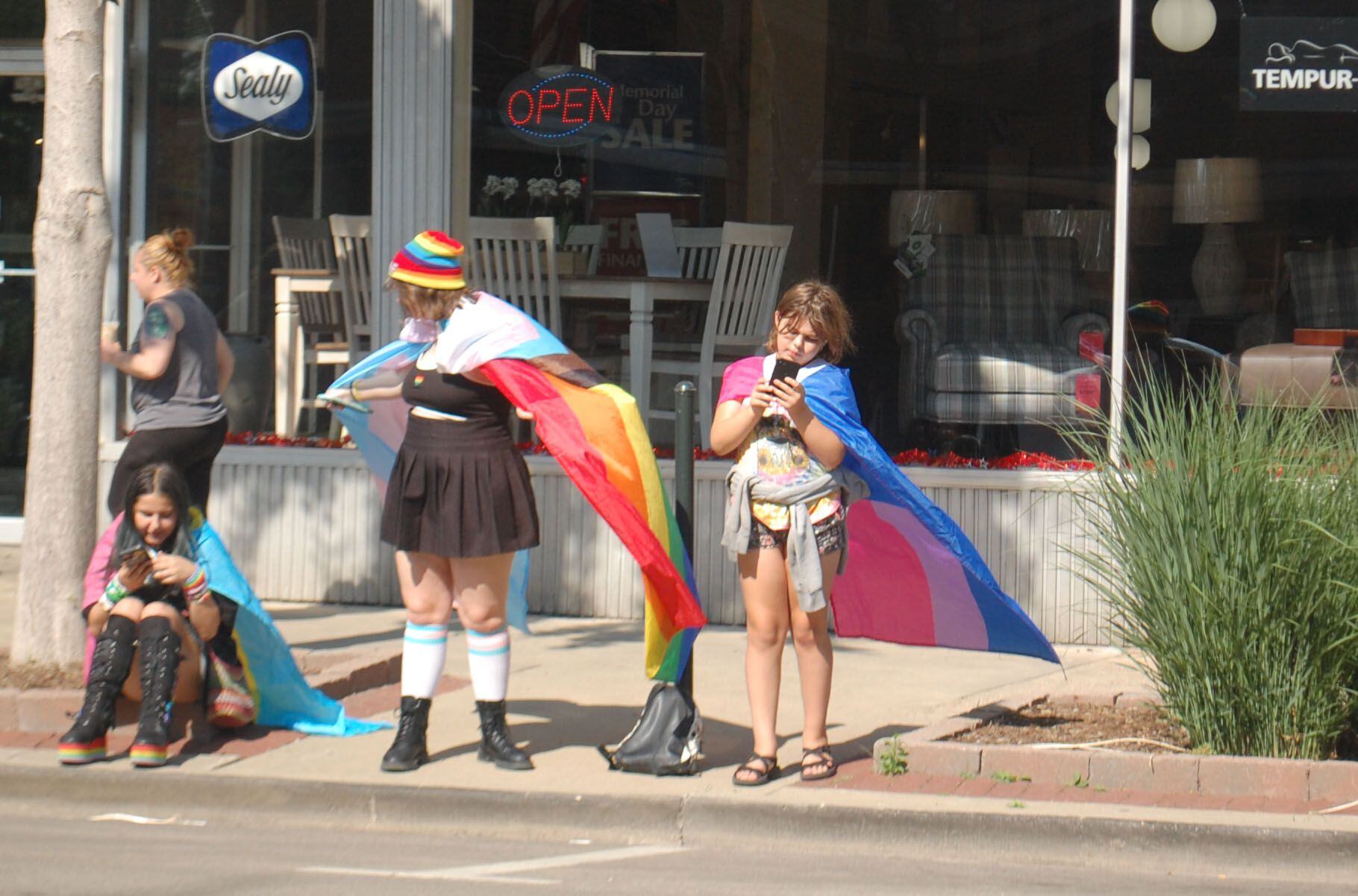 Youths wear their Pride flags like superhero capes as they await the start of the John Fisher Dann Memorial Pride Parade in downtown Ottawa on Saturday, June 10, 2023.