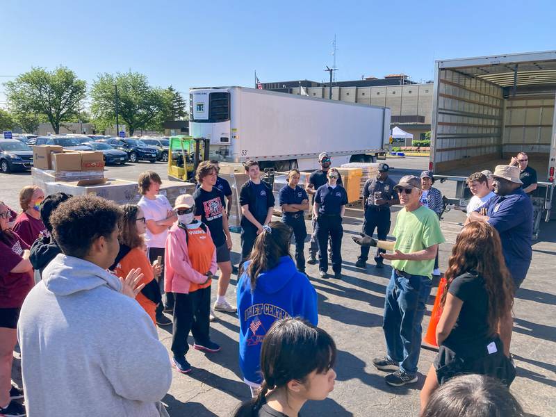 Volunteers prepare to distribute food at the 2023 ShareFest food giveaway. This year’s event will be held on Saturday, May 25, 2024.