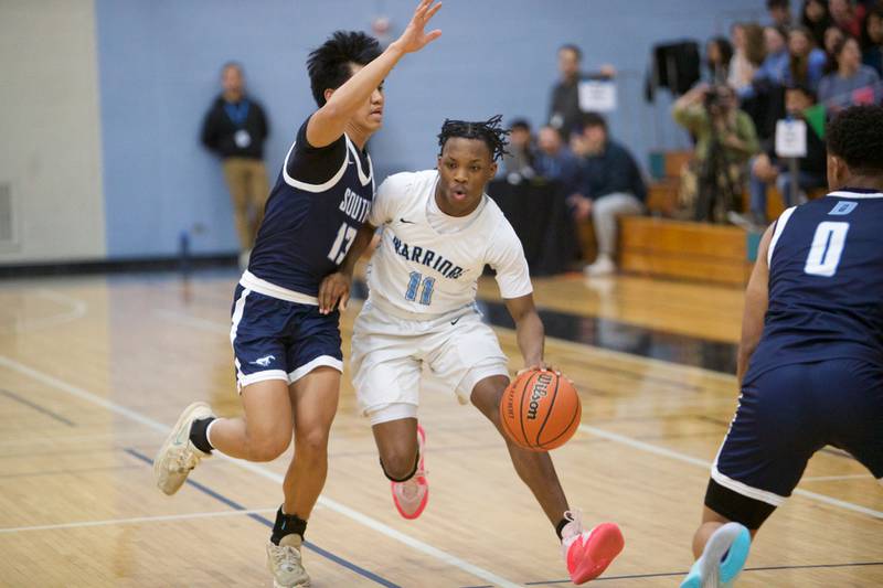 Willowbrook's Jaden Royal advances the ball against Downer Grove South's Richard Gasmen on Friday, Feb.2,2024 in Villa Park.