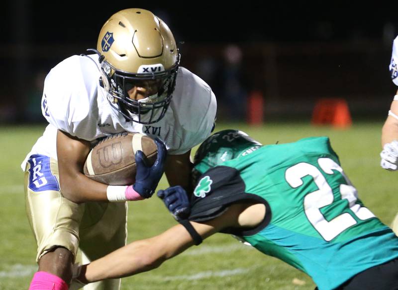 Marquette's Connor Baker carries the ball as he is brought down by Seneca's Brayden Simek on Friday, Oct. 18, 2024 at Seneca High School.