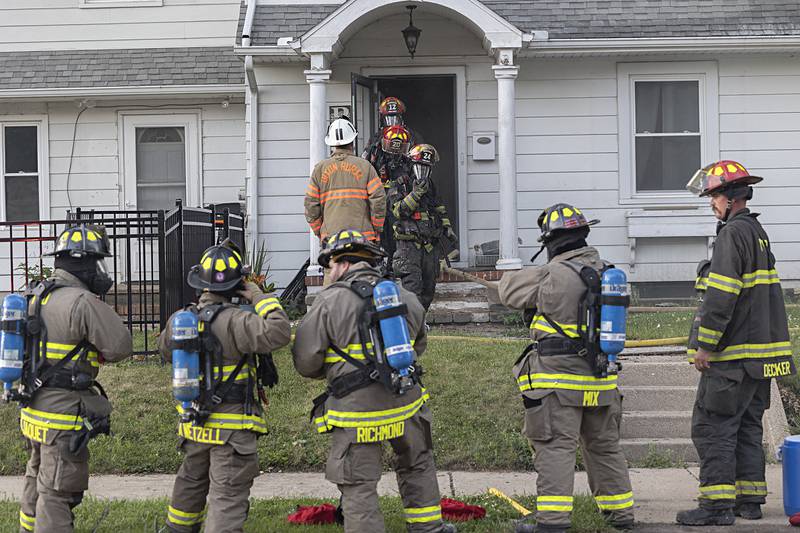 Firefighters work at a house fire Wednesday, June 26, 2024 at 1501 First Avenue in Sterling. Multiple departments responded to the scene including Sterling, Rock Falls, Dixon, Amboy, Morrison and Prophetstown.