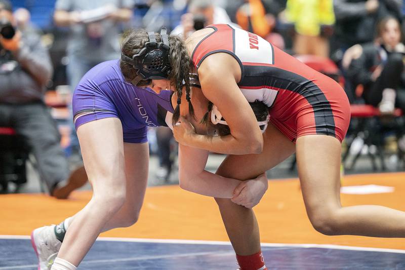 Yamilet Aguirre of Yorkville (right) grapples against Angelina Cassioppi of Rockton in the championship match at the IHSA girls state wrestling championships Saturday, Feb. 25, 2023. Cassioppi won by pin.