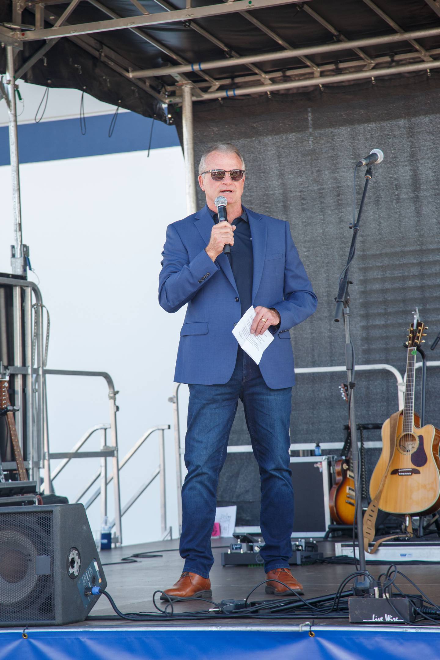 Raynor Garage Doors President Rick Considine speaks during the Sept. 9 grand opening in Dixon.