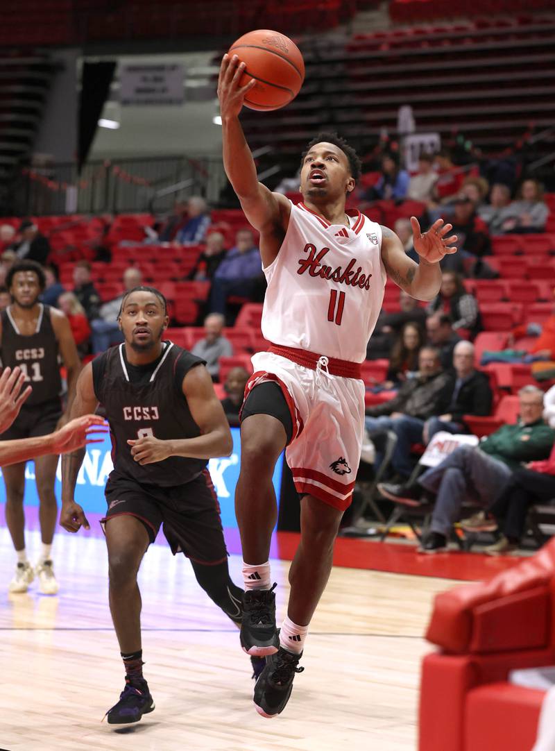 Northern Illinois' David Coit gets to the basket ahead of Calumet's Jabari Hill during their game Monday, Dec. 18, 2023, at the Convocation Center at NIU in DeKalb.