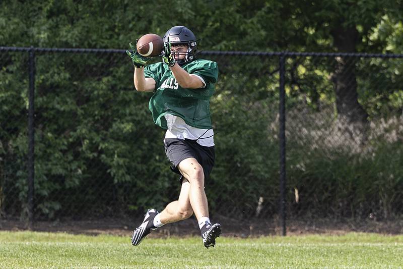 While running through offensive drills, Landon Wade snags a catch Tuesday, July 16, 2024, at Rock Falls football camp.