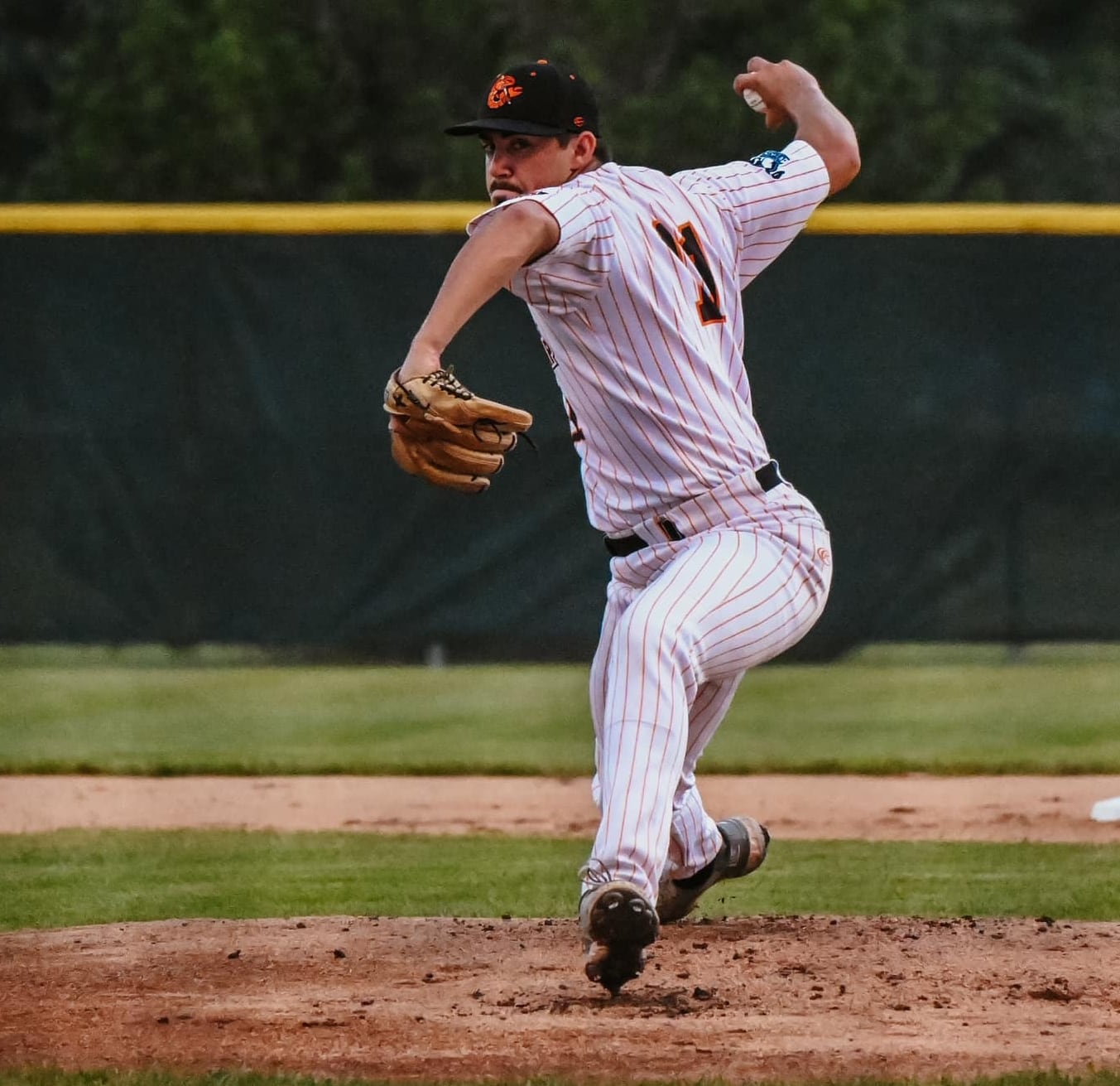 Joseph Martin throws a pitch during the Illinois Valley Pistol Shrimp's 9-8, 11-inning victory over the Normal CornBelters on Wednesday, July 24, 2024 at Schweickert Stadium in Peru.