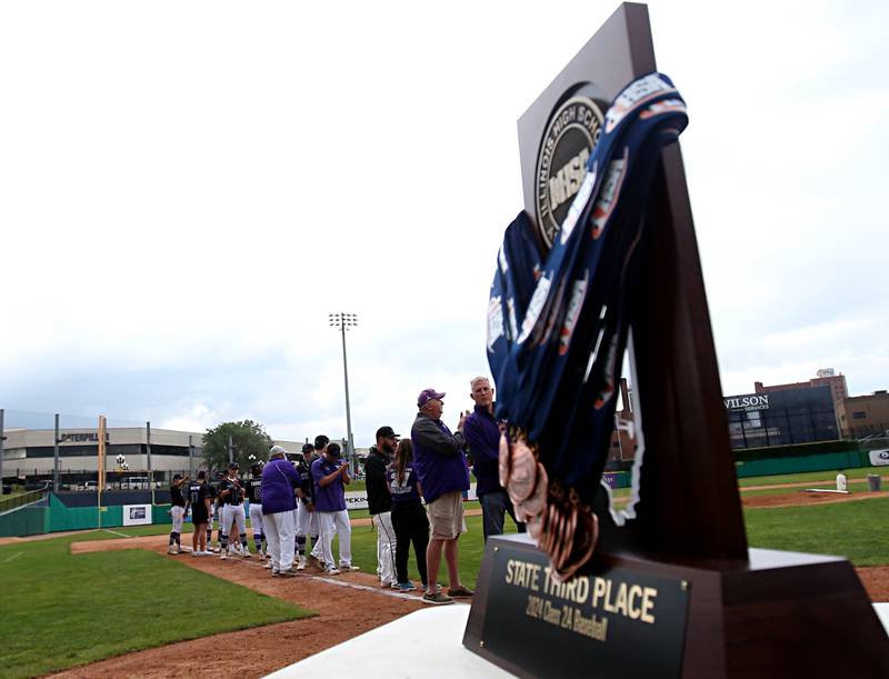 Members of the Wilmington baseball team applaud while receiving the Class 2A third place trophy on Saturday, June 1, 2024 at Dozer Park in Peoria.