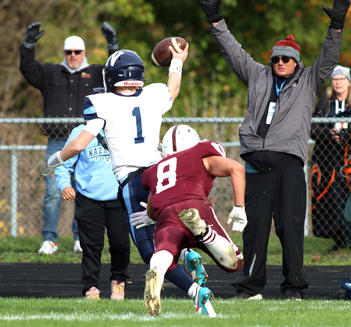 Nazareth’s Logan Malachuk (1) storms into the end zone with a touchdown in first-round Class 5A playoff football action at Crystal Lake Saturday.