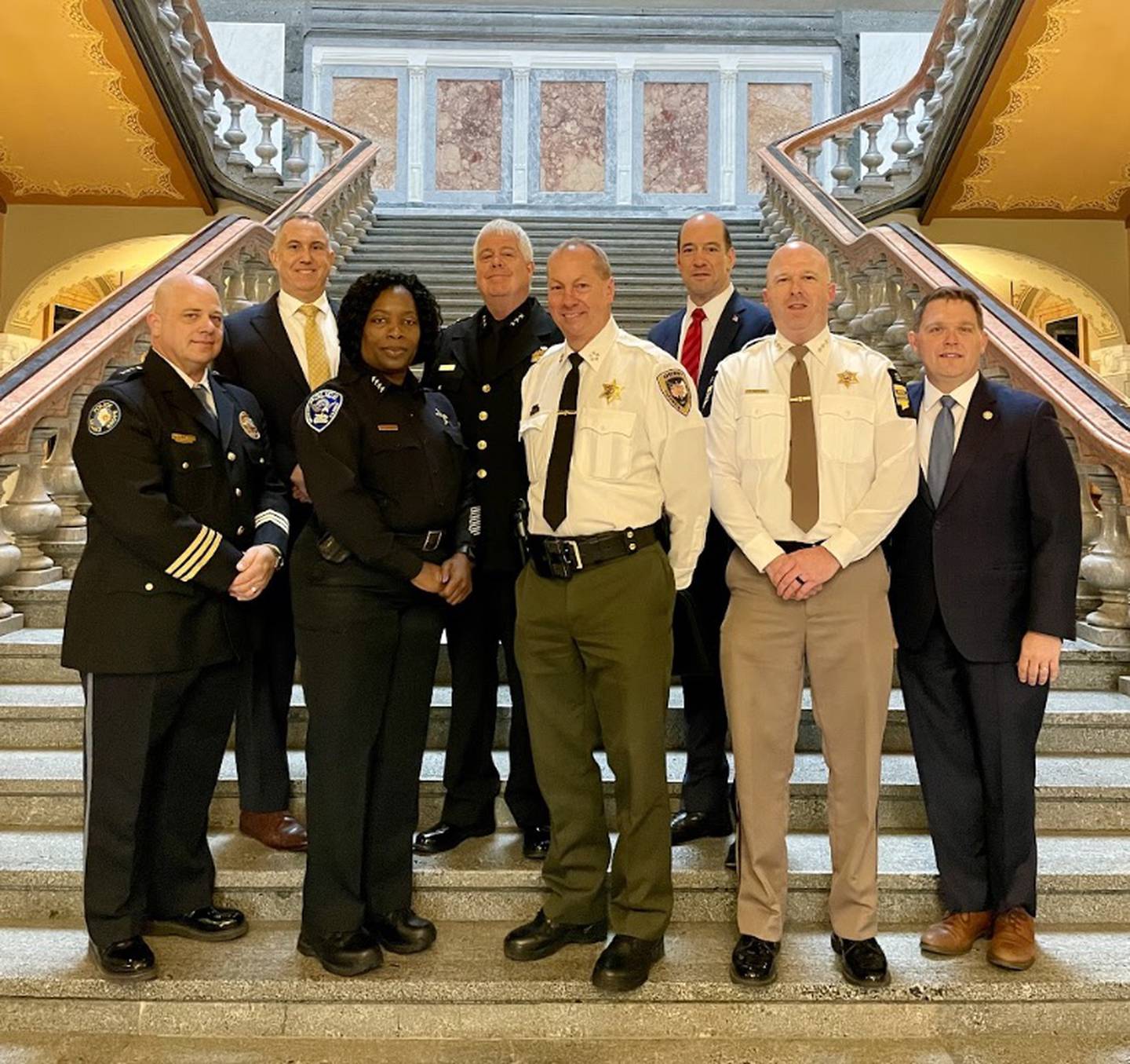 Kendall County State’s Attorney Eric Weis (far left, back row) joined other state’s attorneys, police chiefs and sheriffs in Springfield in March to speak with Illinois House and Senate leaders on  funding of programs for children that prevent crime and reduce recidivism.