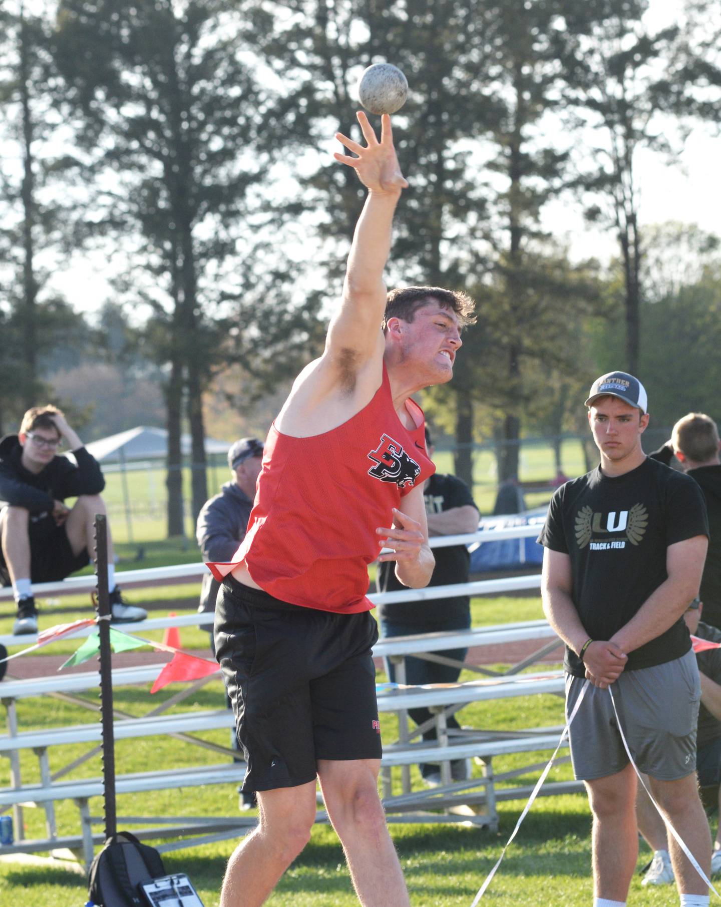 Erie-Prophetstown's Caleb Naftzger throws the shot at the Hawk Classic in Oregon on Friday, April 2