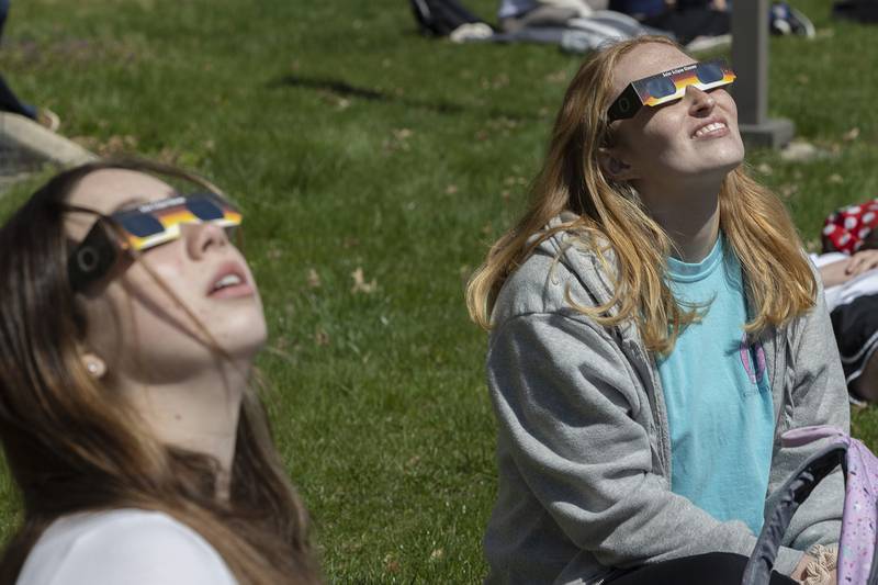 Marissa Wadsworth (left) of Morrison and Lexi Miniel of Dixon stargaze at the solar eclipse Monday, April 8, 2024 at Sauk Valley Community College.