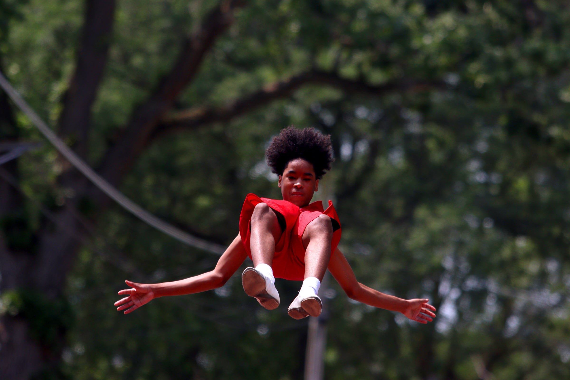 The Jesse White tumblers perform as part of the Fiesta Days parade along Main Street in McHenry Sunday.