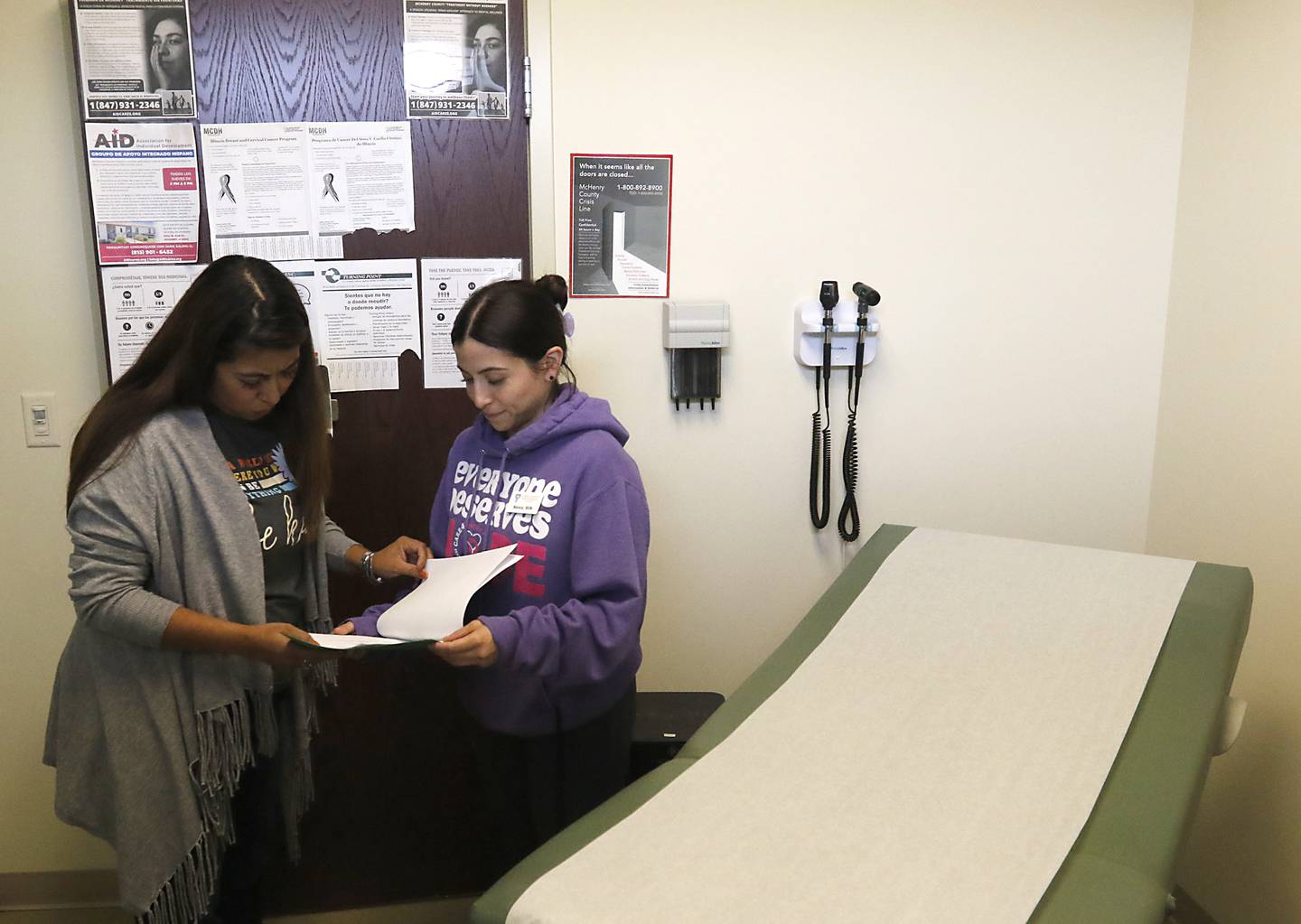 Jaret Ross, a social worker with Family Health Partnership Clinic, talks with nurse Nancy Estrada on Thursday afternoon, Sept. 28, 2023, at the Crystal Lake clinic.  Social services agencies like the Family Health Partnership Clinic asking the county for more money for mental health treatment as part of the county's 2024 budget.