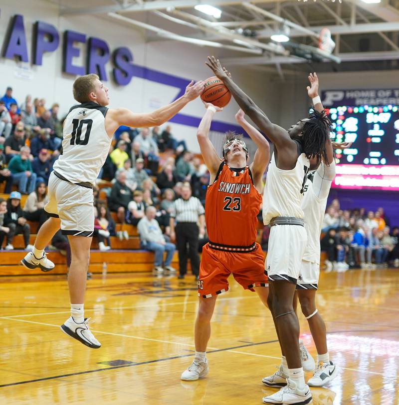 Photos Kaneland vs. Sandwich boys basketball in the 60th Plano