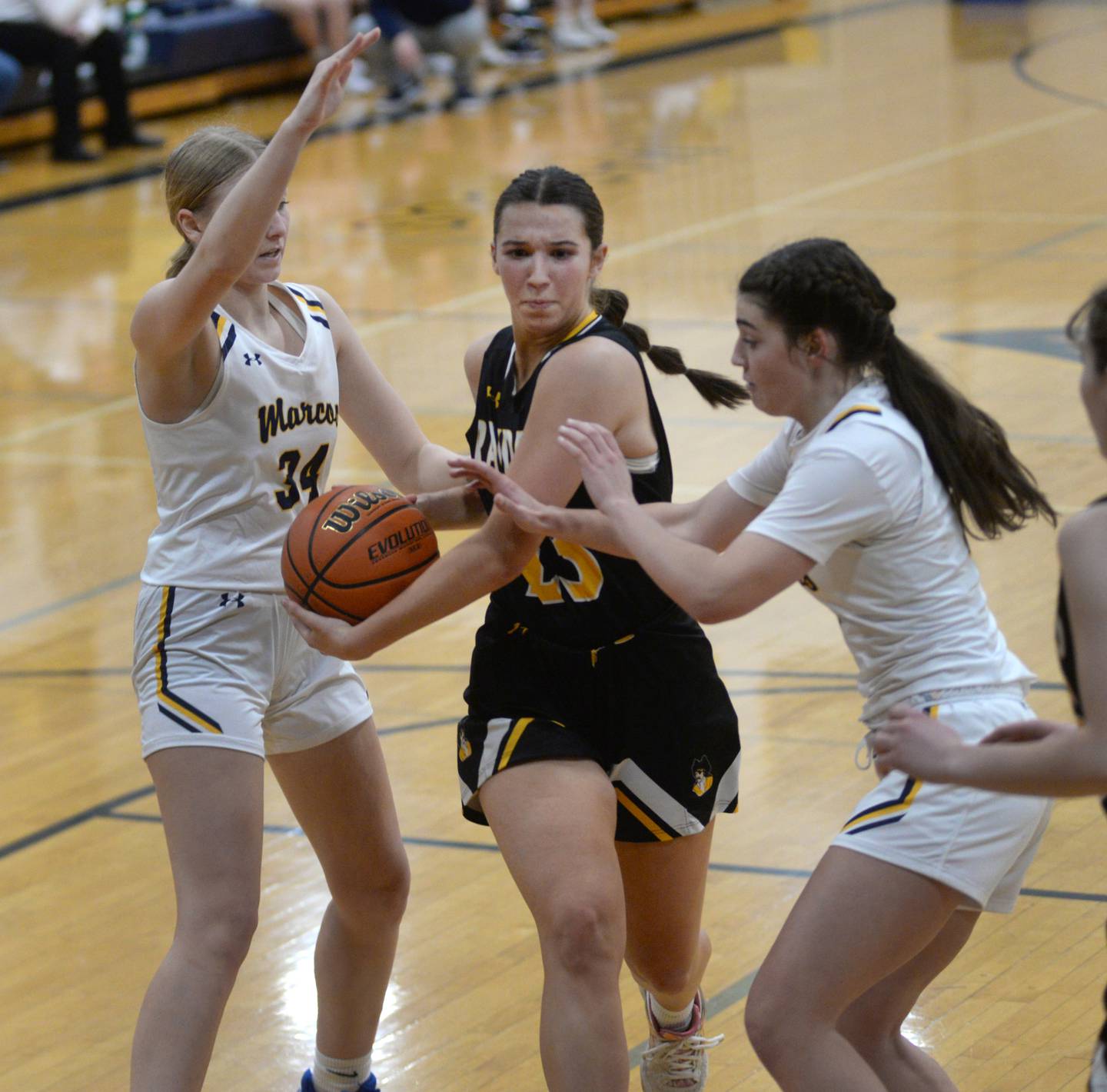 Ashton-Franklin Center's Brianna Gonnerman drives to the basket as Polo's Syndei Rahn (left) and Elsa Monaco defend during Wednesday, Jan. 3, 2023 action at Polo High School.