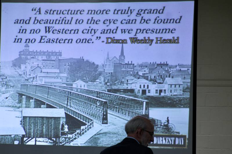 A photograph from the north shore of the Rock River of the Truesdell Bridge is shown during the Founders Day celebration held Tuesday, April 11, 2023, at Loveland Community House and Museum in Dixon. The bridge was located in almost the same spot as the current Galena Avenue Bridge.