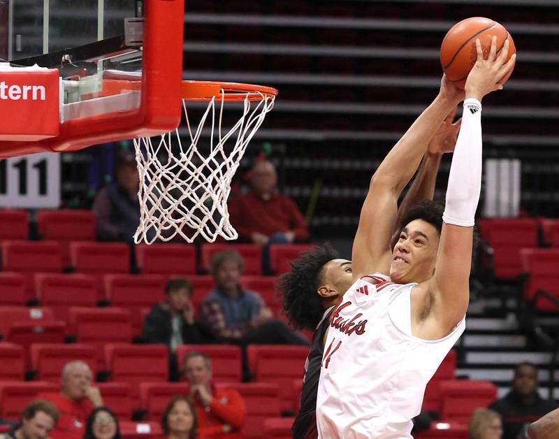 Northern Illinois' Yanic Konan Niederhauser dunks the ball during their game against Calumet Monday, Dec. 18, 2023, at the Convocation Center at NIU in DeKalb.