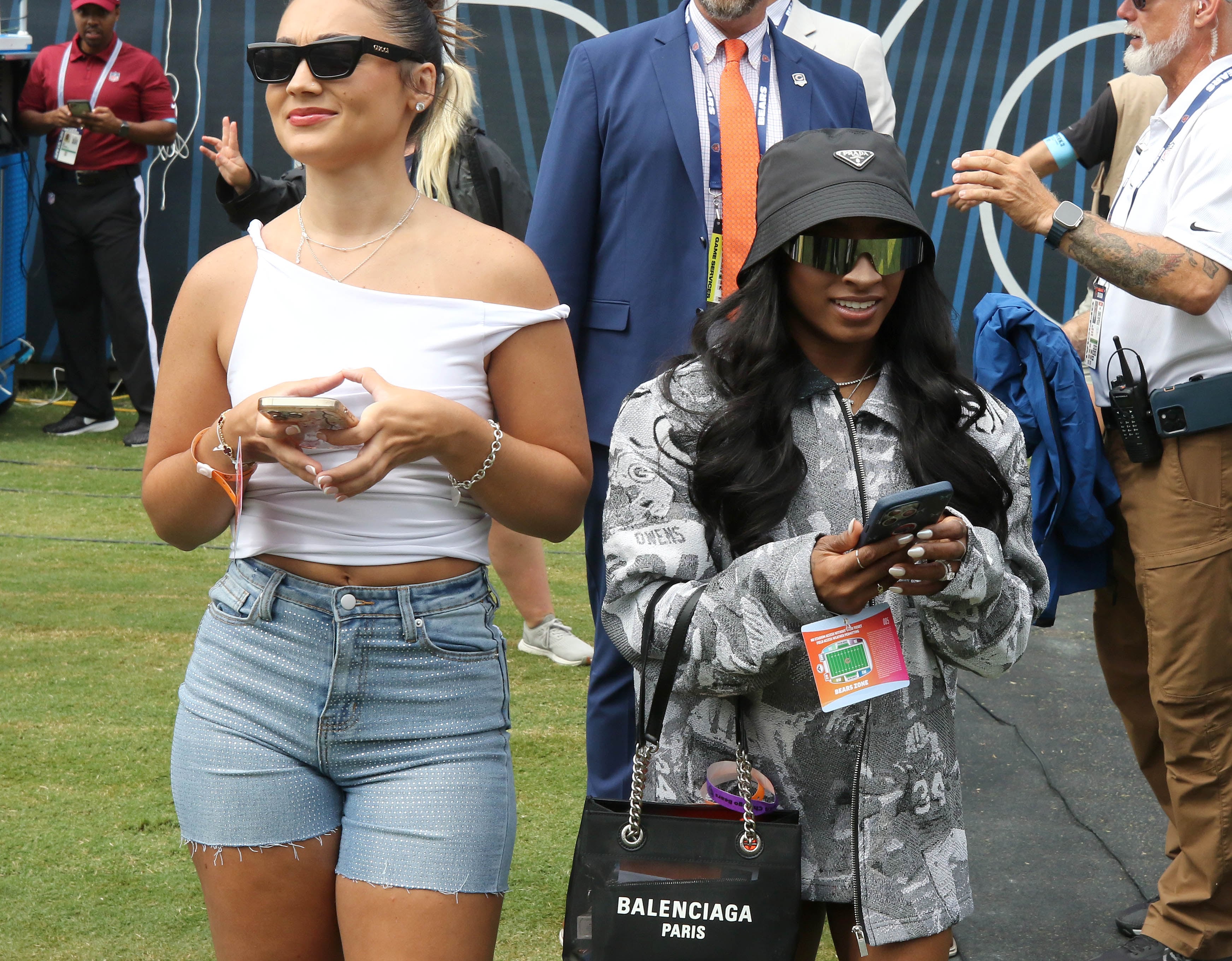 Simone Biles, (right) Olympic gold medal gymnast and wife of Chicago Bears safety Jonathan Owens, makes an appearance on the sidelines before the Bears meet the Cincinnati Bengals Saturday, Aug. 17, 2024, at Soldier Field in Chicago.