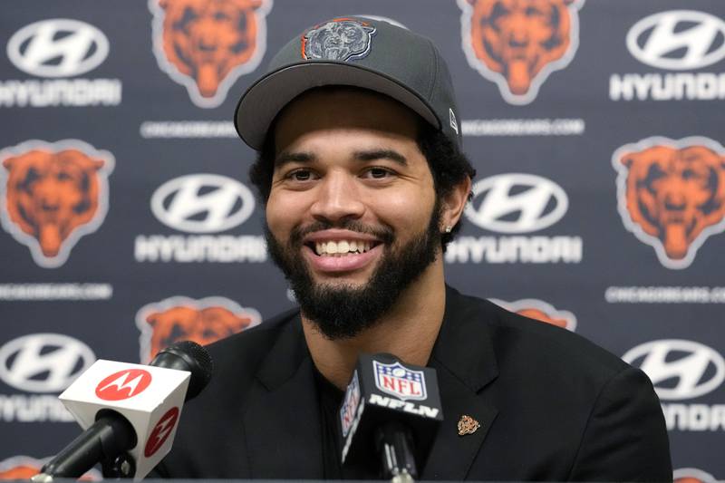 Chicago Bears No. 1 draft pick quarterback Caleb Williams smiles as he listens to reporters during an NFL football news conference in April in Lake Forest, Ill.
