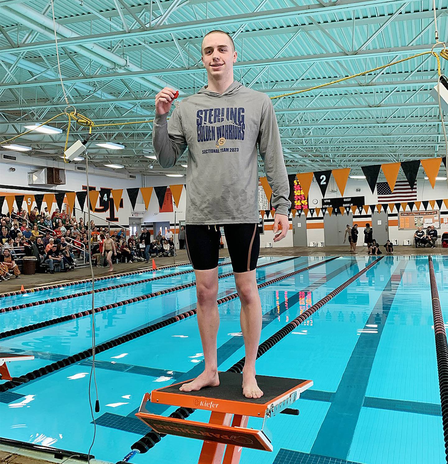 Sterling swimmer Skylar Drolema poses with his second-place medal after swimming the 50-yard freestyle at the United Township Sectional on Saturday, Feb. 18, 2023 in East Moline. Drolema qualified for state in the event.