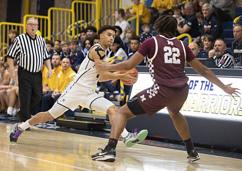 Sterling’s Andre Klaver looks to pass against Moline Friday, Dec. 1, 2023 in Sterling.