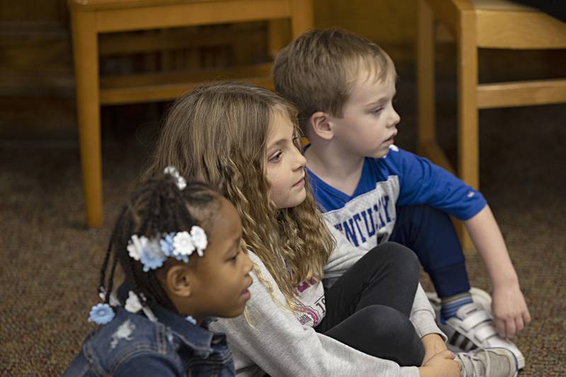 A group of youngsters sit and watch as the puppets dance across the stage Thursday, Nov. 16, 2023 at the Dixon library.