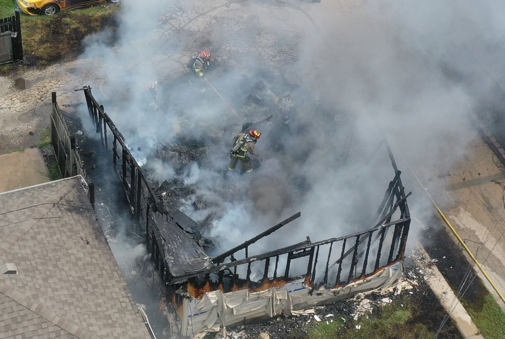 La Salle and Peru firefighters extinguish a garage fire in the 800 block of Lafayette Street on Monday, July 22, 2024. The fire began just before 1p.m. La Salle Fire and EMS along with Peru Fire department responded to the call while La Salle Police directed traffic.