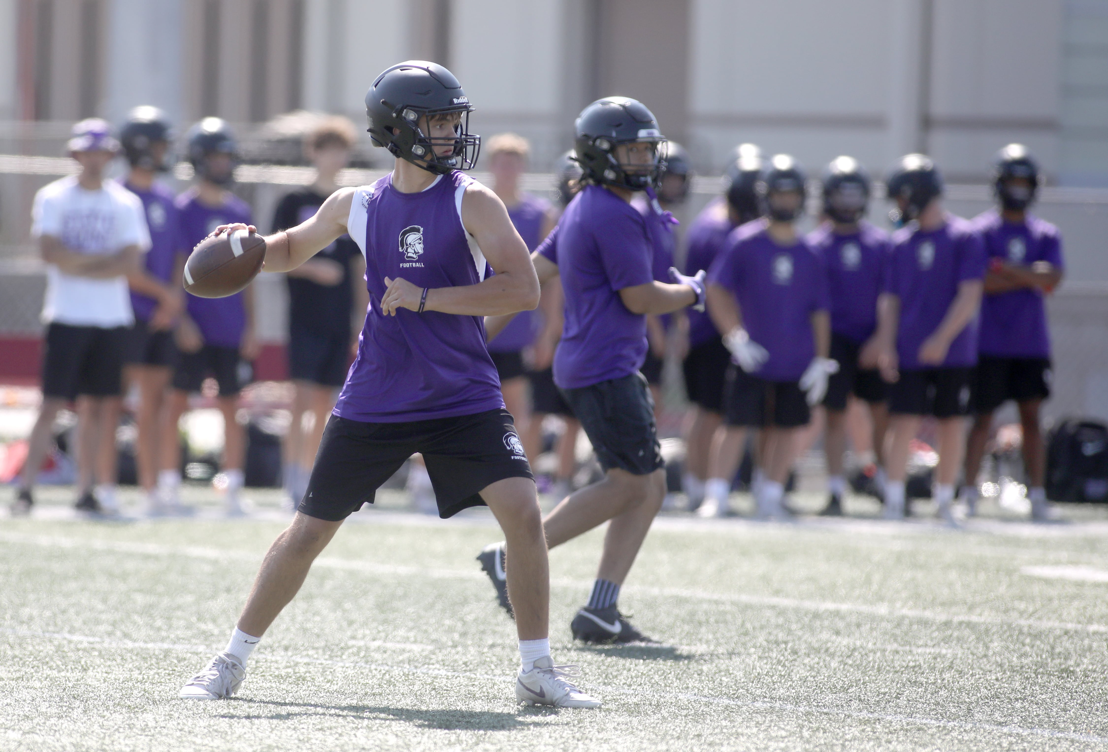 Downers Grove North quarterback Owen Lansu looks to throw the ball during a 7-on-7 tournament at Batavia High School on Thursday, July 18, 2024.