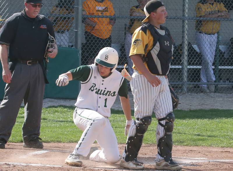 St. Bede's Aidan Mullane scores a run against Putnam County on Tuesday, April 30, 2024 at St. Bede Academy.