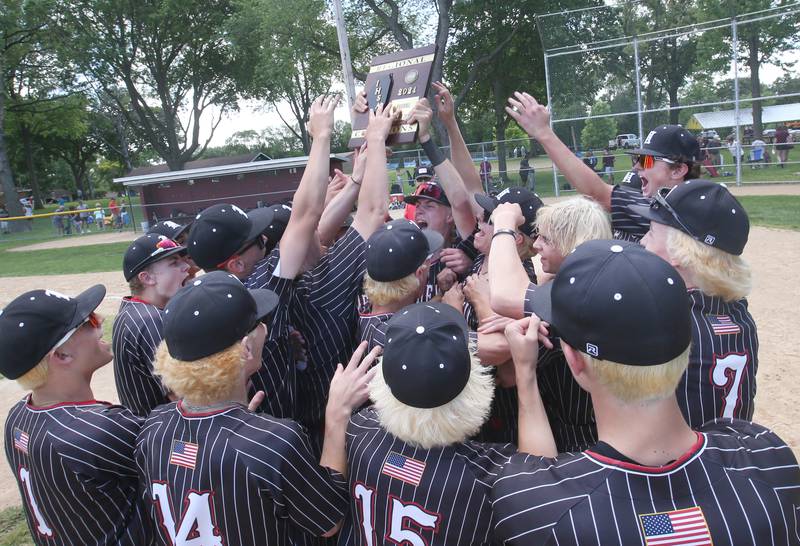 Members of the Hall baseball team hoist the Class 2A Regional title plaque after defeating Chillicothe on Saturday, May 28, 2024 at Kirby Park in Spring Valley.