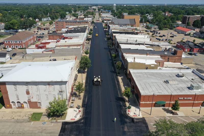 An aerial view South Main Street at crews pave the road wth fresh blacktop on Tuesday, Aug. 13, 2024 downtown Princeton.