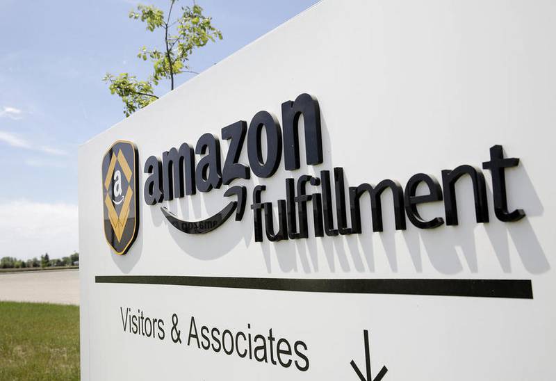 A sign directs traffic through the Joliet Amazon.com fulfillment center Wednesday in Joliet. The Seattle-based company announced Wednesday it will open a second fulfillment center in Joliet and add 2,000 jobs.